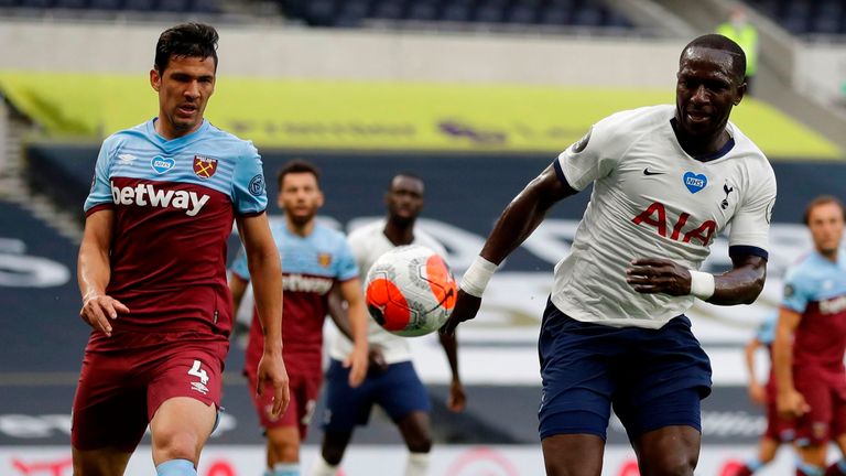 Moussa Sissoko vies with West Ham's Fabian Balbuena