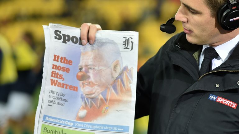 Alex Payne holds up the New Zealand Herald which depicted  Warren Gatland as a clownwent too far 