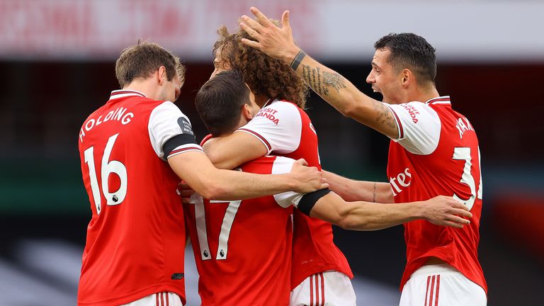 Cedric is mobbed by team-mates after scoring against Norwich