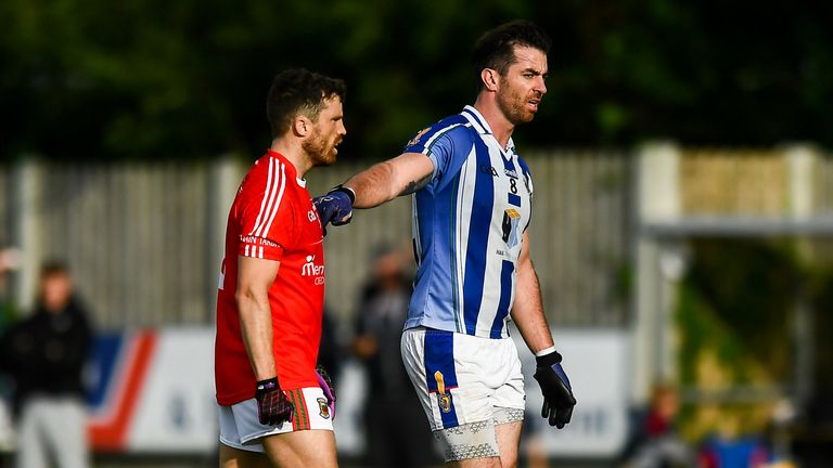 Michael Darragh Macauley of Ballyboden St Enda's being marked by Mayo star Chris Barrett, who recently transferred to Clontarf