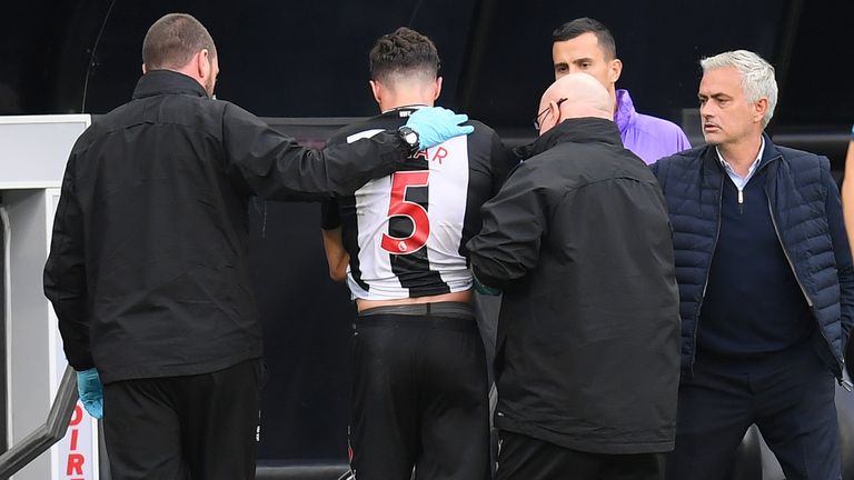 Newcastle defender Fabian Schar went off with a dislocated shoulder