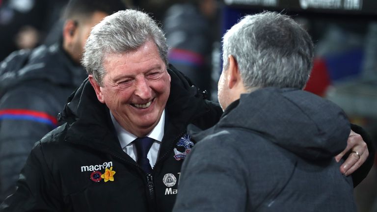 Mourinho shares an embrace with Hodgson during his time as Manchester United manager
