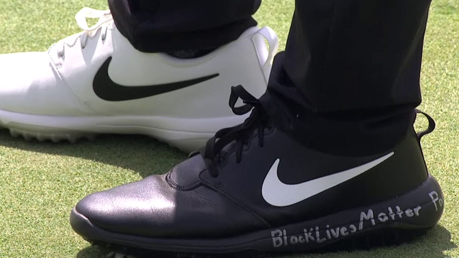 Champ wears black and white shoes to kick off Black 