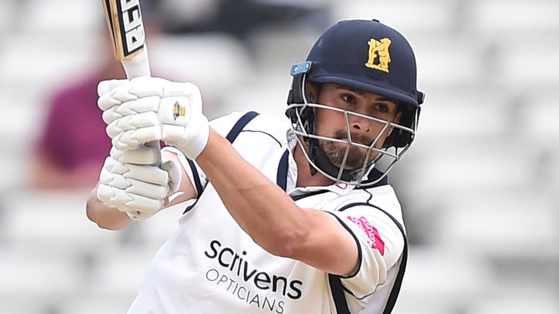 Rhodes ton puts Warwickshire on top