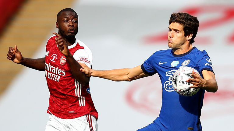 Marcos Alonso and Nicolas Pepe vie for possession at Wembley