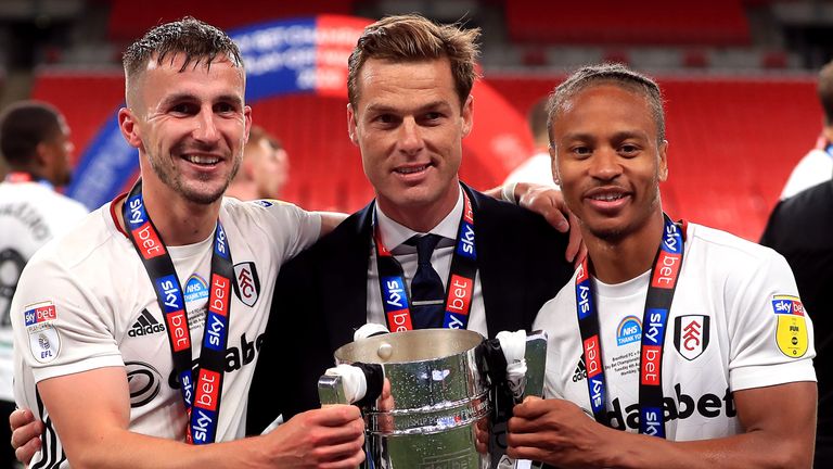 Scott Parker celebrates Fulham's promotion with Joe Bryan (L) and Bobby Reid