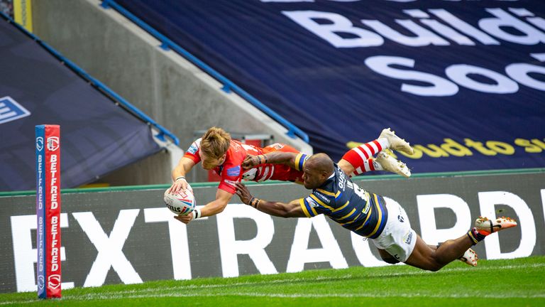 Salford's Josh Johnson is prevented from scoring a try by Rob Lui