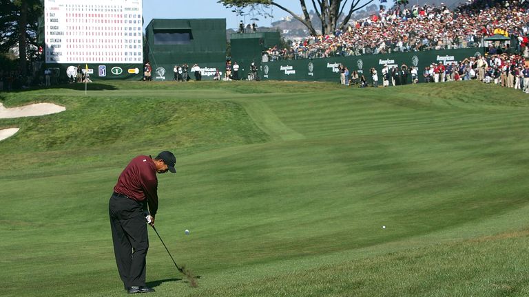 Woods hits his approach shot on the 18th hole during the play-off