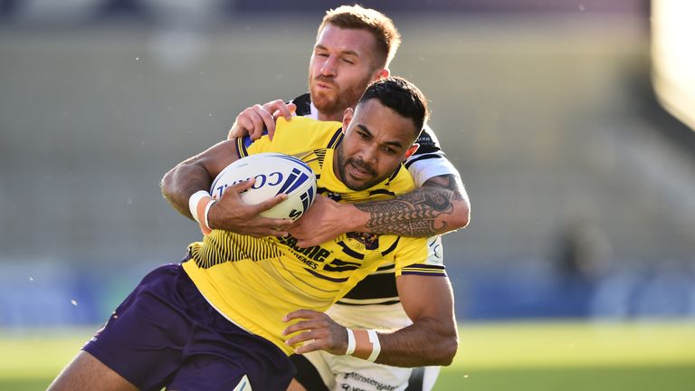 Bevan French  is tackled by Marc Sneyd
