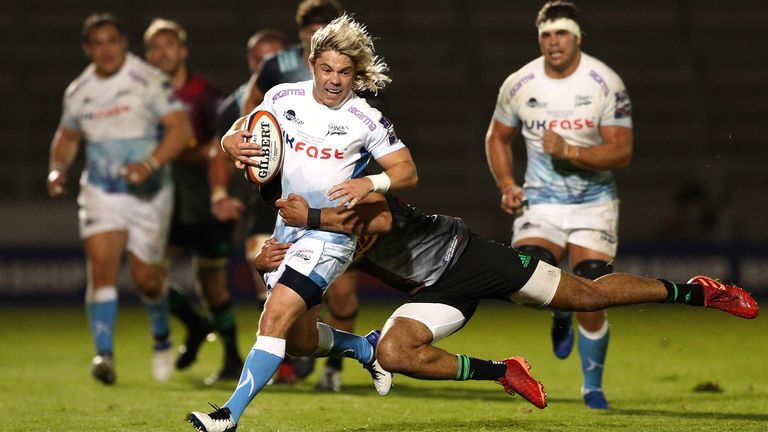 Faf de Klerk is hauled down after making a break for the Sharks