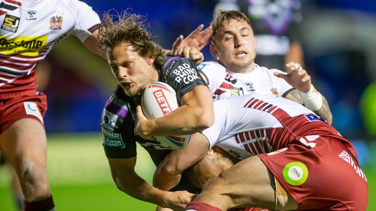 Wakefield's Jacob Miller about to score a try against Wigan.