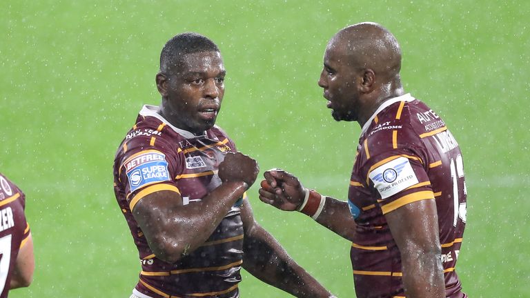 Michael Lawrence (R) congratulates Jermaine McGillvary  scoring his try