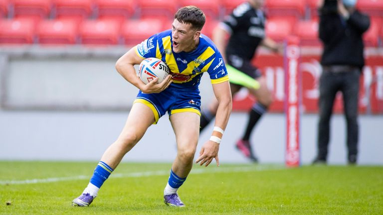 Josh Thewlis celebrates his try for Warrington