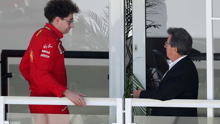 Louis Camilleri (R) in discussion with Ferrari team principal Mattia Binotto at the Tuscan GP