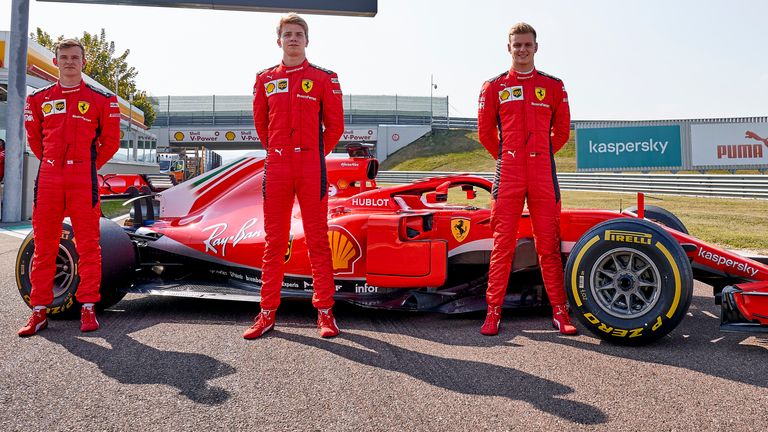 Left to right: Callum Ilott, Robert Shwartzman and Schumacher with Ferrari's race-winning 2018 car