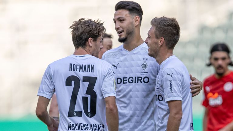 Gladbach's Ramy Bensebaini celebrates his team's fourth goal