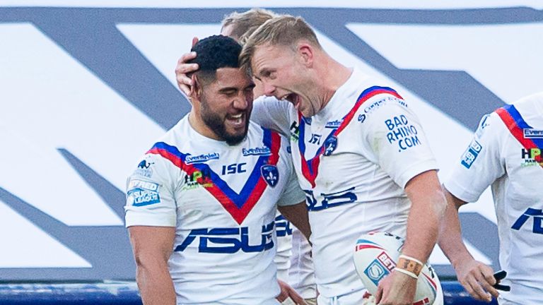 Adam Tangata and Craig Kopczak (second from right) celebrate the latter's try 