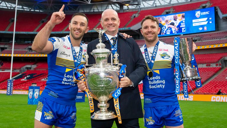 Leeds's captain Luke Gale, head coach Richard Agar and Lance Todd Trophy winner Richie Myler celebrate their win