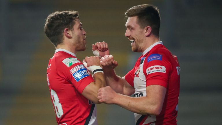 Salford's Ed Chamberlain (R) celebrates his try with Chris Atkin.