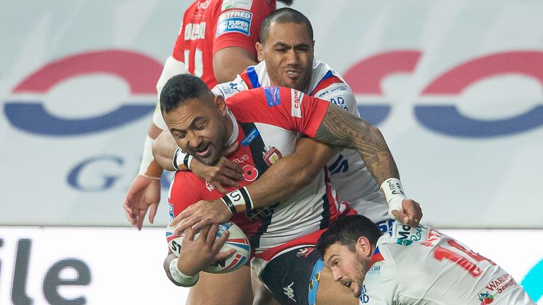 Salford's Krisnan Inu is tackled by Wakefield's Bill Tupou & Jay PItts.