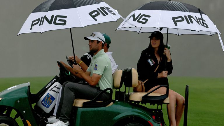 The players were returned to the clubhouse after play was suspended.