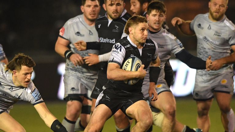 Tom Penny makes a break for Newcastle