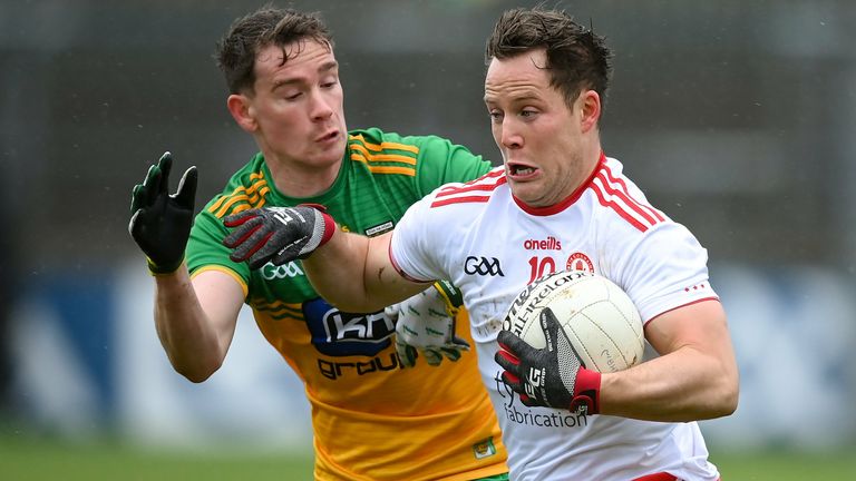 Kieran McGeary of Tyrone in action against Ciaran Thompson of Donegal