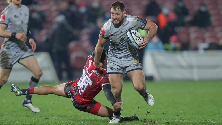 Sam Hill of Sale Sharks looks to evade the tackle of Gloucester's Kyle Moyle