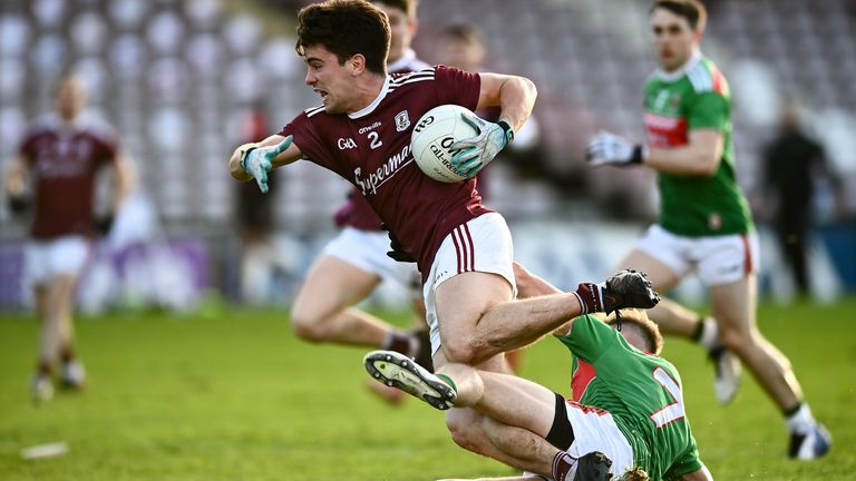 Sean Kelly of Galway is tackled by Eoghan McLaughlin of Mayo late in the Connacht final