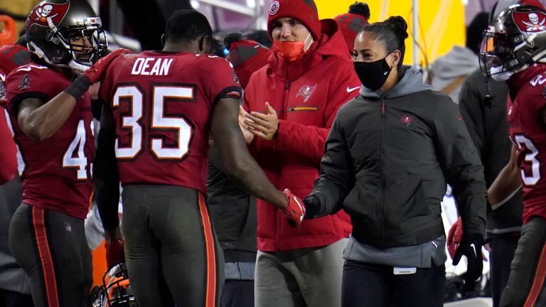 Tampa Bay Buccaneers cornerback Jamel Dean talks with assistant strength/conditioning coach Maral Javadifar during the second half of their Wild Card clash with Washington. (AP Photo/Julio Cortez)