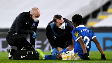 Image of Lamptey receives treatment on the pitch before being taken off against Fulham