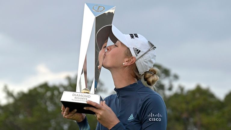 Jessica Korda kisses the trophy after winning the Tournament of Champions