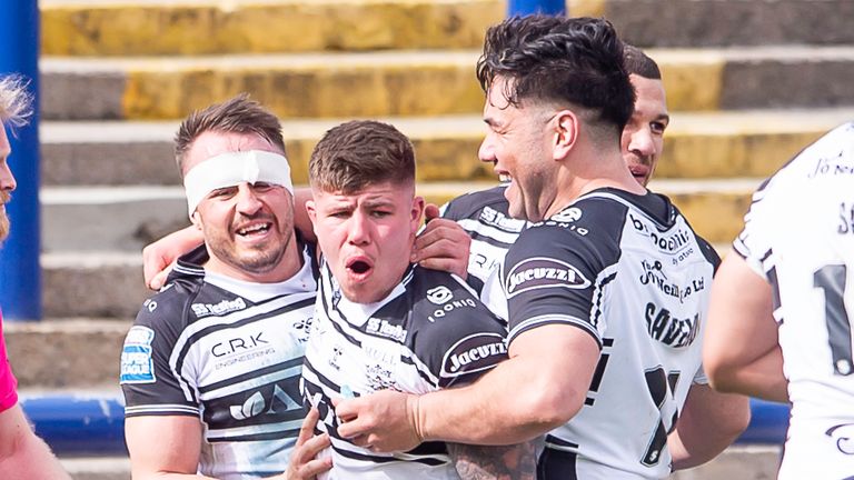 Hull FC's Josh Reynolds (bandaged) is congratulated by Joe Cator & Andre Savelio on his try against Huddersfield 