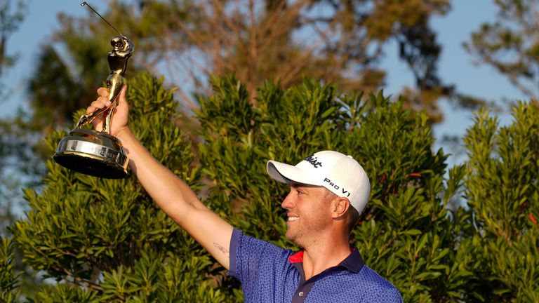 Justin Thomas holds the trophy after winning The Players Championship