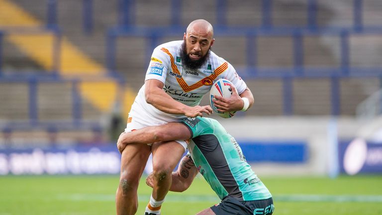 Catalans' Sam Kasiano takes on Hull KR's defence