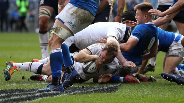 Scrum-half Scott Steele gets over for Scotland's sixth score 