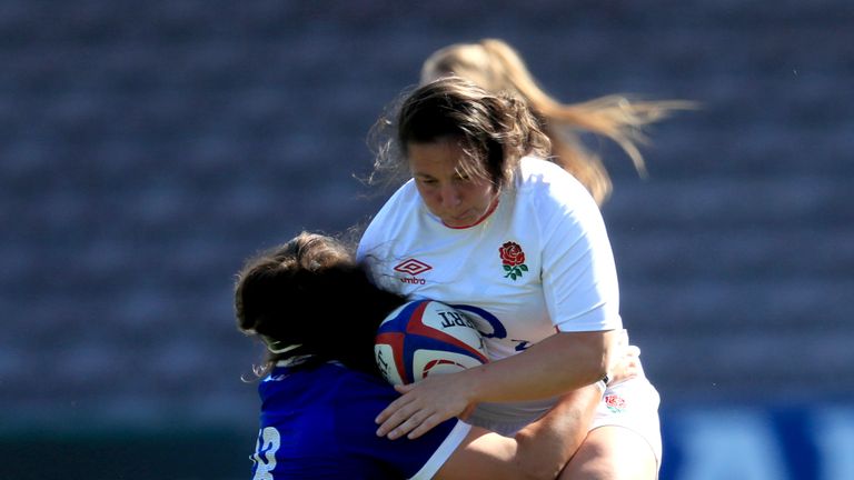 England's Amy Cokayne runs with the ball