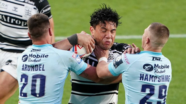 Hull FC's Andre Savelio is tackled by Wakefield Trinity's Joe Arundel (left) and Ryan Hampshire