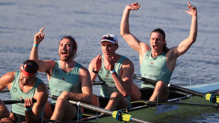 Members of the Cambridge men's crew celebrate winning
