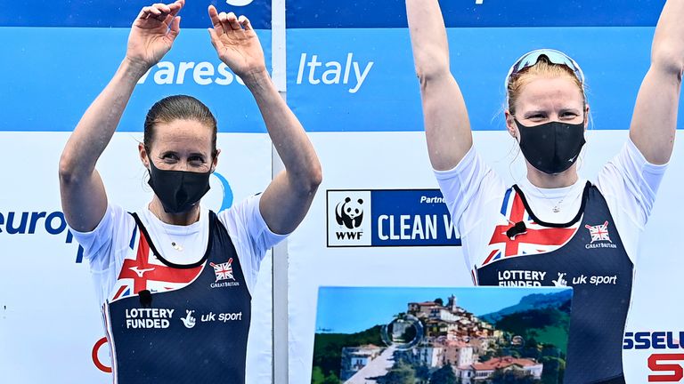 Helen Glover and Polly Swann of Great Britain celebrate on the podium after winning gold in the European Rowing Championships