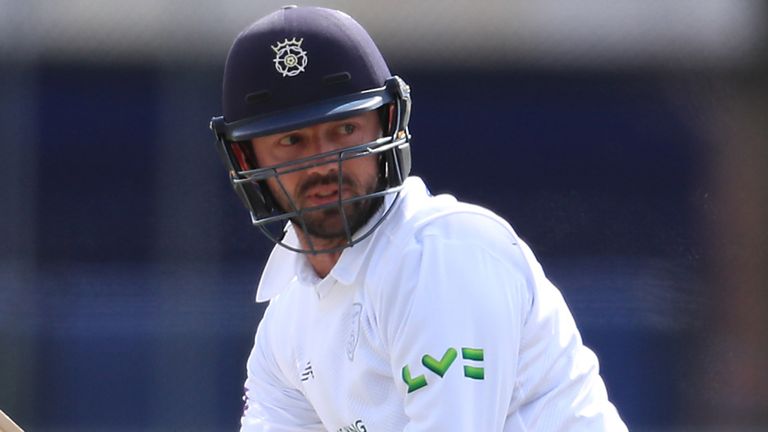 Ian Holland's half-century helped second-placed Hampshire to an eighth win of the campaign