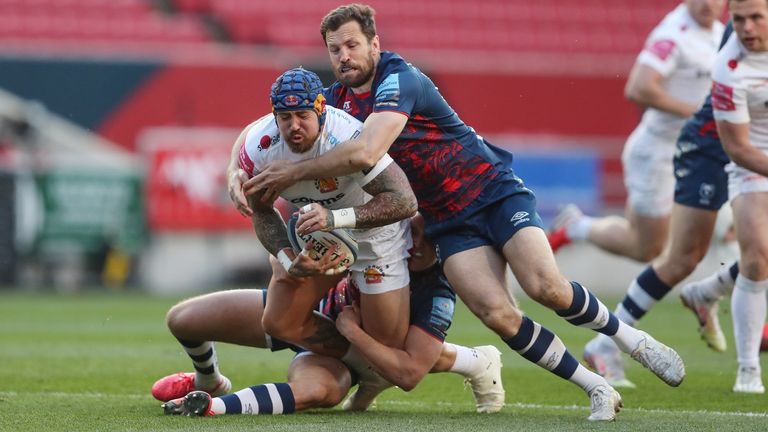 Jack Nowell is tackled by Bristol Bears' Max Malins and Luke Morahan
