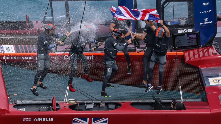 The British team celebrating on board their F50 after their final victory (Image Credit - Simon Bruty for SailGP)
