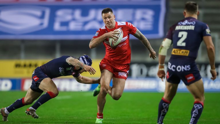 Hull KR's Shaun Kenny-Dowall is tackled by St Helens' Theo Fages