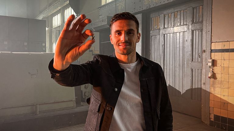 Ajax captain Dusan Tadic hold sup the commemorative star which will be sent to all of the club's season-ticket holders