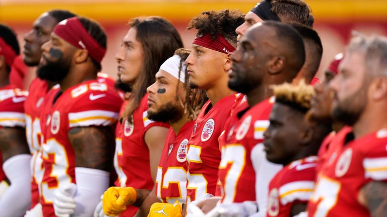 The Kansas City Chiefs link arms in solidarity during a social justice presentation ahead of their 2020 season opener against the Houston Texans