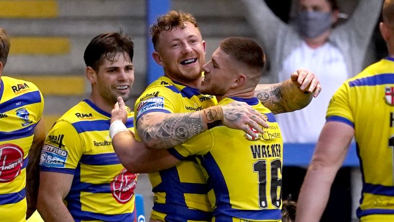 Josh Charnley celebrates a try against Wakefield
