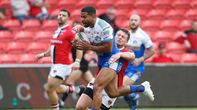 Kruise Leeming runs in to score the Rhinos' sixth try