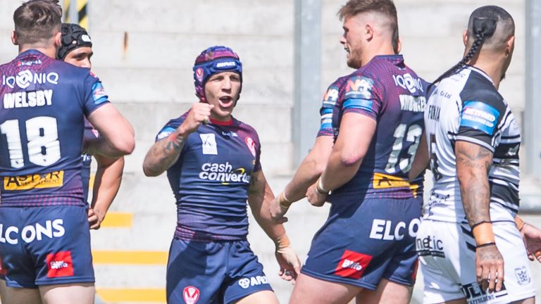 Theo Fages celebrates after scoring a try against Hull FC