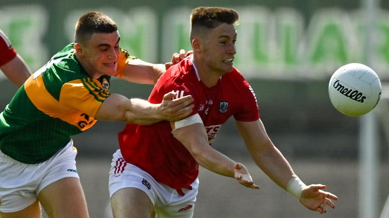 Kevin Flahive of Cork in action against Seán O'Shea of Kerry